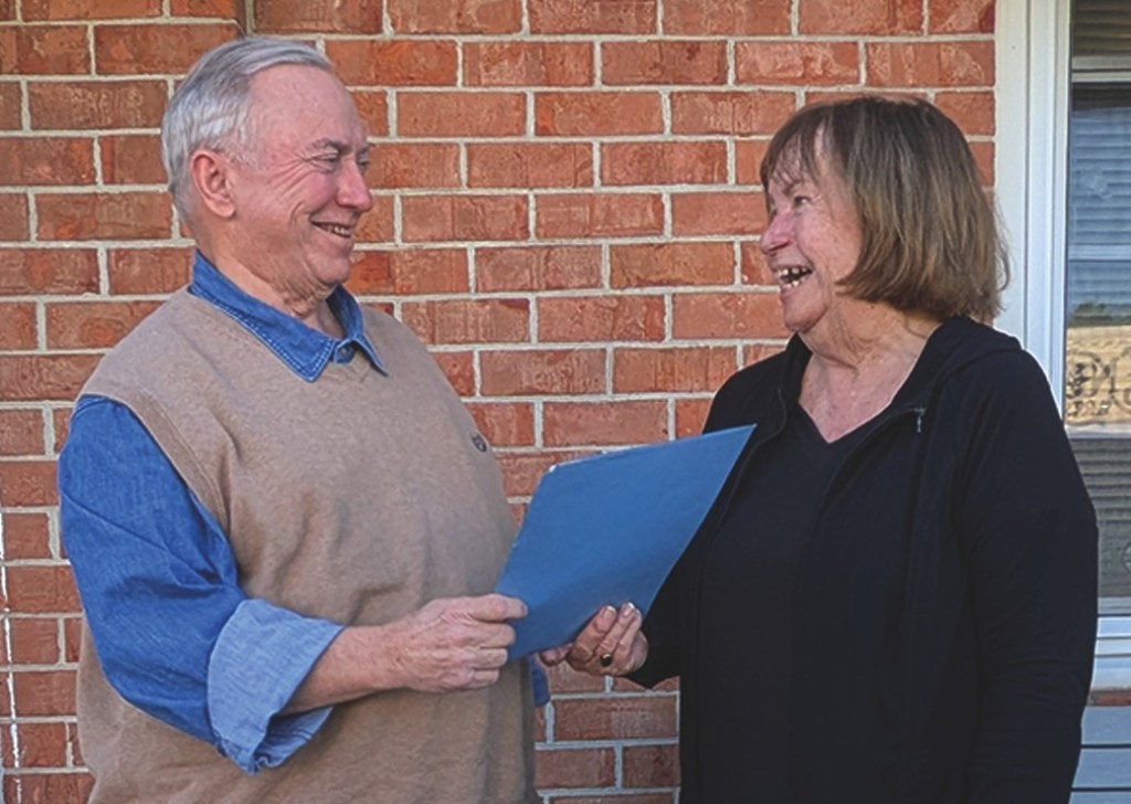 Bob Mason receives Life Membership from Friend's President, Frances Callaghan